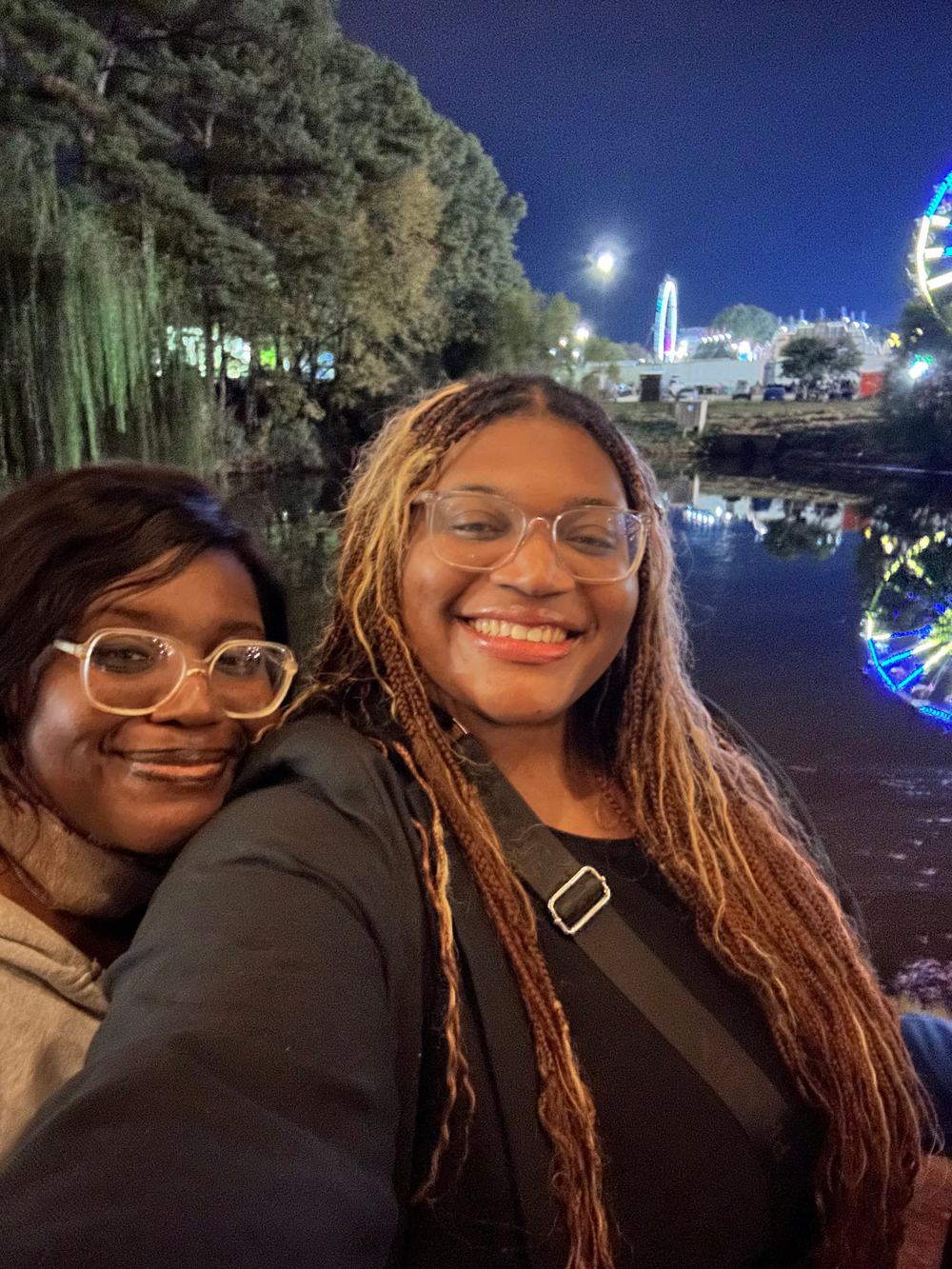 Crystal-Bel and Oriana, co-founders of Bassey Home & Reset, together on an evening walk by the water.